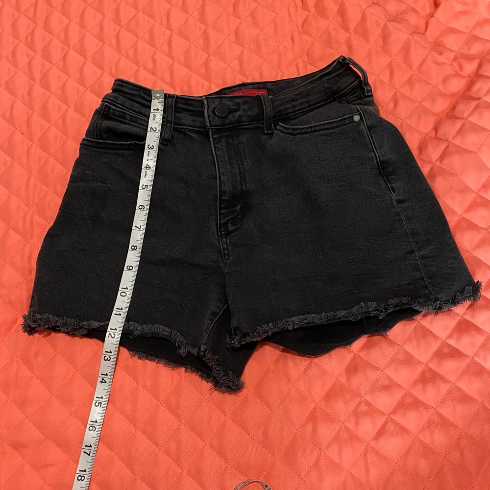 Jennifer Lopez black high rise shorts